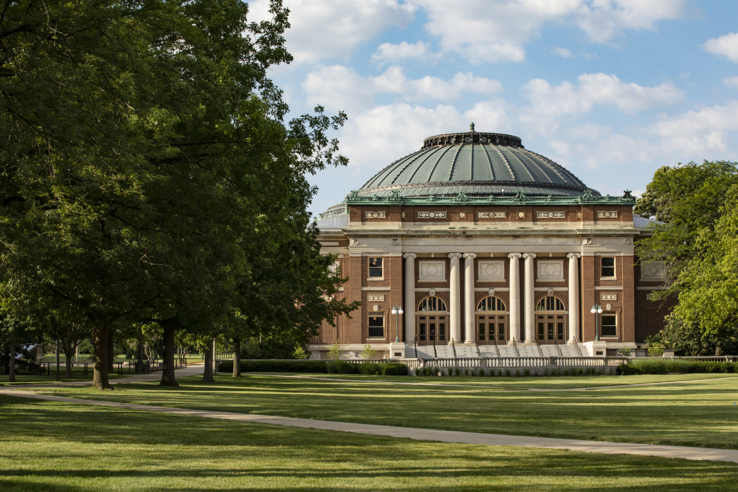 foellinger auditorium surrounded by green grass and trees
