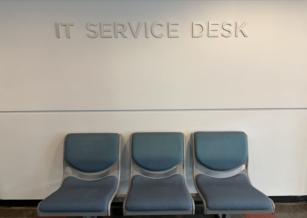 The new sign for the IT Service Desk in shiny silver letters